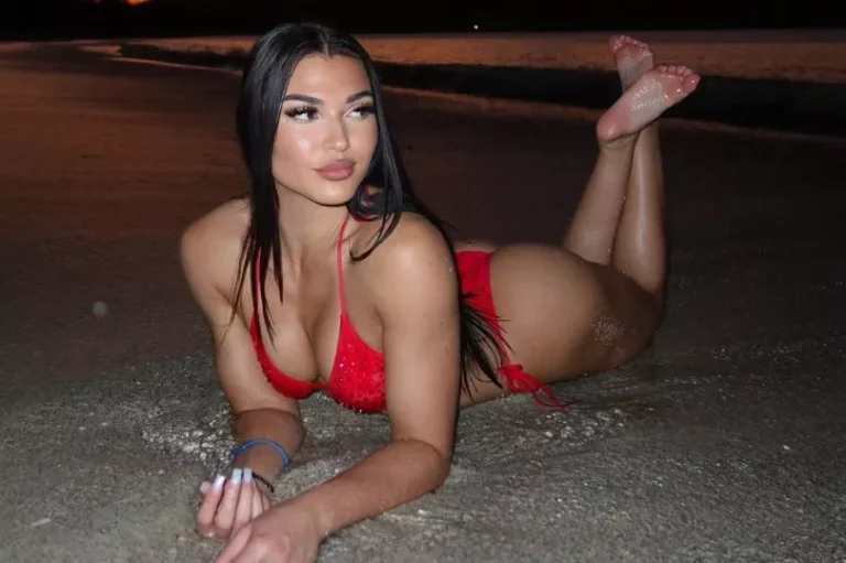 Former football player-turned-WWE star Jazmyn Nyx in her short red bikini